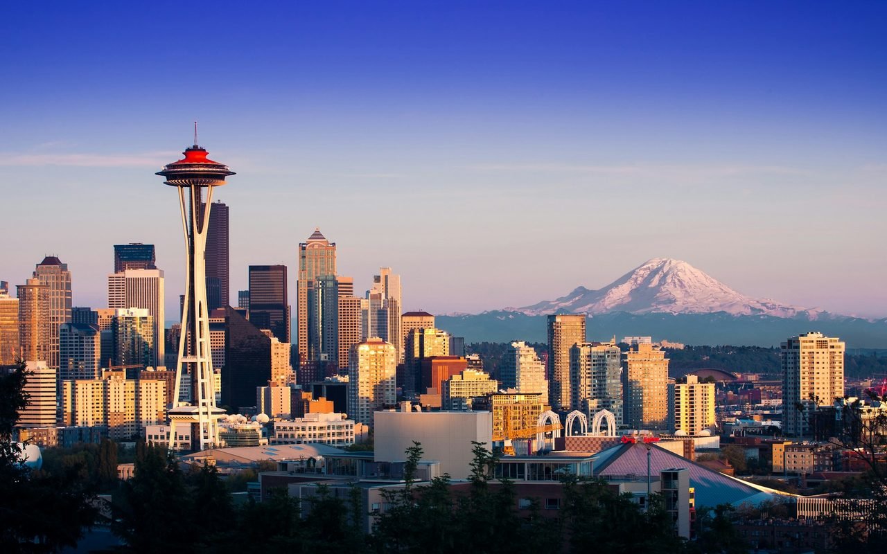 The Space Needle and downtown Seattle with Mount Rainier behind